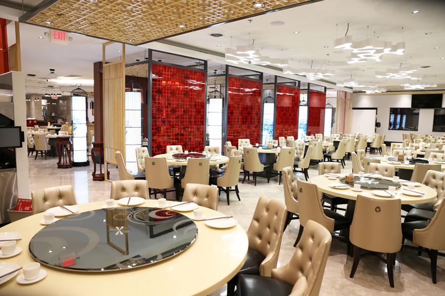 MingHin dining room with cream seating and red screens